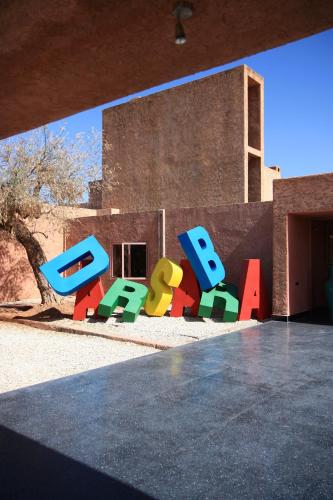 a sign that says boo in front of a building at Dar Sabra in Marrakech