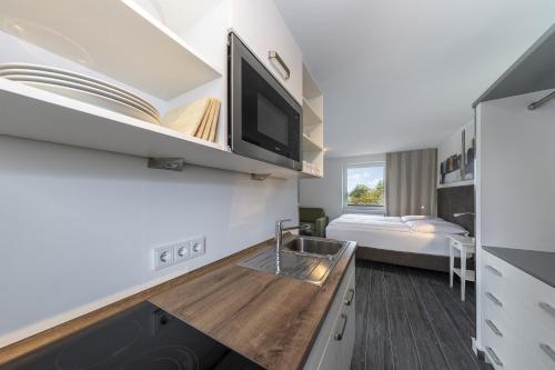 Postel nebo postele na pokoji v ubytování Beach Hotel California