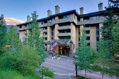 a building with a flag in front of it at Vail's Mountain Haus at the Covered Bridge in Vail