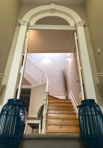 a staircase in a house with blue vases at Fishtail Sea House in Matosinhos
