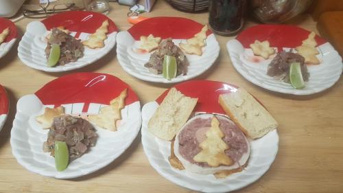 a group of paper plates with food on them at kazAnne in Pointe-Noire