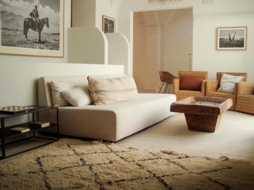 a living room with a couch and a table at Can Araya in Ciutadella