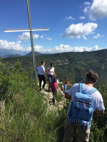 a group of people walking on a mountain trail at La Galisesagnoise in Briançonnet