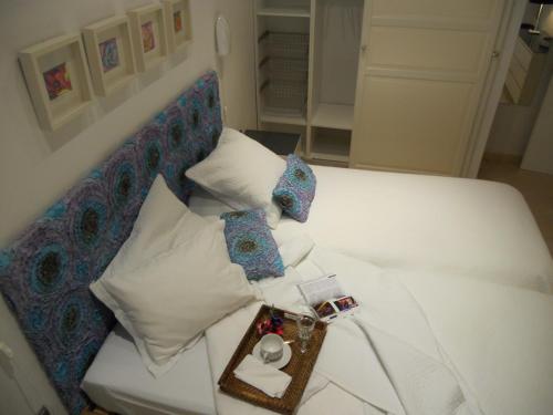 Cama o camas de una habitación en Logia Sevilla