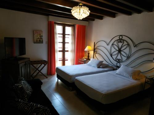 Giường trong phòng chung tại Casa India Catalina
