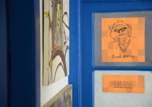 two framed pictures of a man on a wall at Brasileranza Hostel in Niterói