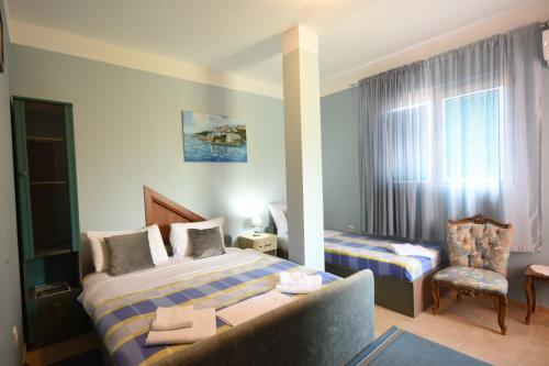 Postel nebo postele na pokoji v ubytování Apartments Astel