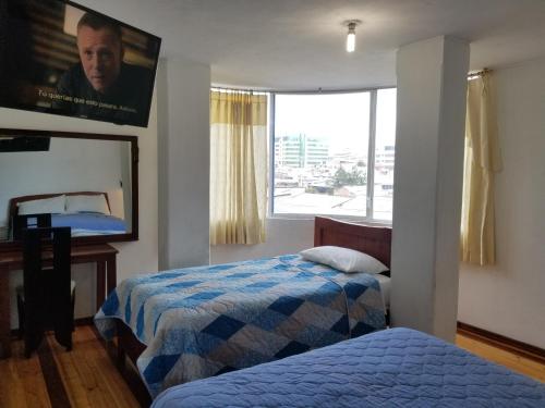 Postel nebo postele na pokoji v ubytování Hotel Ventura