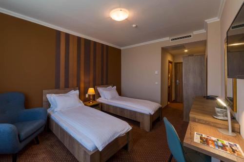Postel nebo postele na pokoji v ubytování Sky Hotel