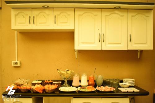 a kitchen counter top with a bunch of food on it at Belmont B&B in La Paz