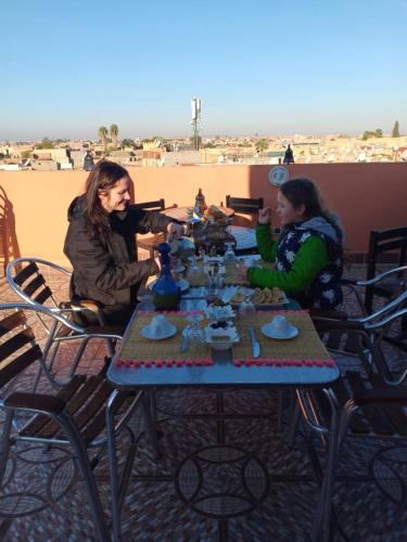 a group of people sitting at a table at Dar HAJAR in Marrakech