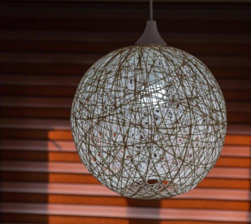 a white disco ball hanging from a ceiling at Brioni in Virpazar