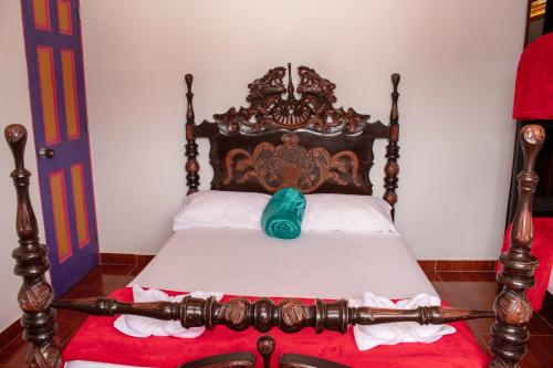 Cama o camas de una habitación en Hostal Palmas De Cocora