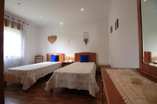 Ein Bett oder Betten in einem Zimmer der Unterkunft Casa da Amoreira