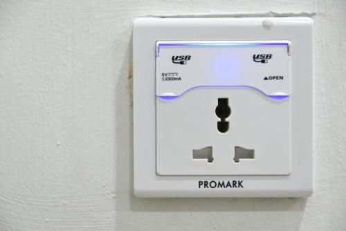 a white lightswitch on a wall with the words promax at Langkawi Cozy Holiday Home at Taman Indah by Zervin in Kuah