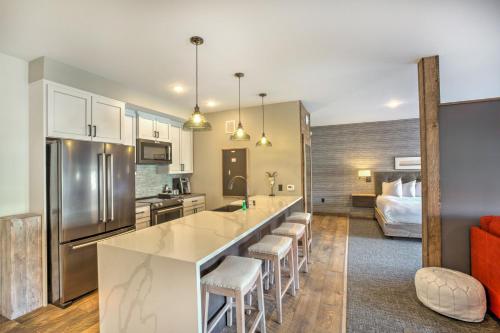 a kitchen with a large island in a room at Hotel Crosby in Stillwater