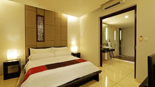 En eller flere senge i et værelse på Villa 58 Tanah Lot