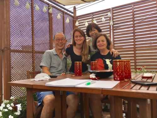 a group of people sitting at a table at Ys Bed & Kitchen Tokyo #HY1 in Tokyo