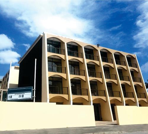 a large building with balconies on the side of it at 14 on Marine in East London