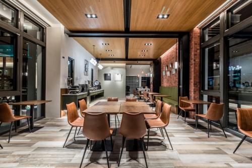 a dining room with a table and chairs at Grange Inn in Taitung City