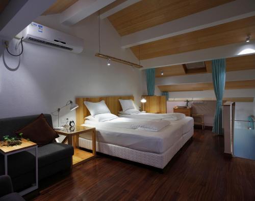 Katil atau katil-katil dalam bilik di Hangzhou Shange Laolongjing Hotel
