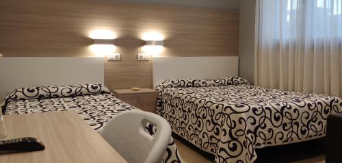 Una cama o camas en una habitación de Hotel Goizalde