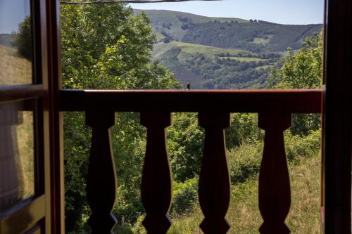 a window with a view of the mountains at Casa Katton in Etxalar