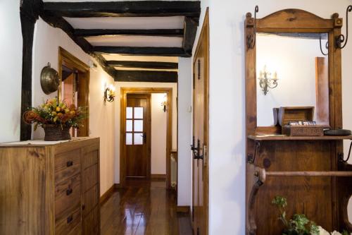 a kitchen with wooden cabinets and a wooden ceiling at Casa Katton in Etxalar