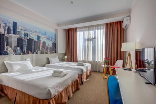 TV a/nebo společenská místnost v ubytování Hotel Bridges Bishkek