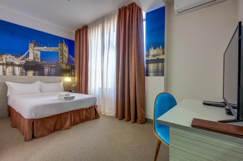 Postel nebo postele na pokoji v ubytování Hotel Bridges Bishkek