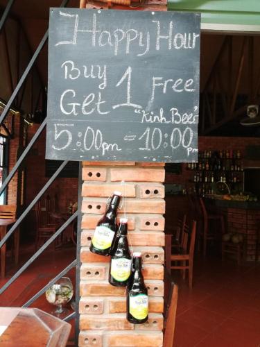 a sign with three bottles of beer on a display at Gia Thanh Phu Quoc Guest House in Phu Quoc