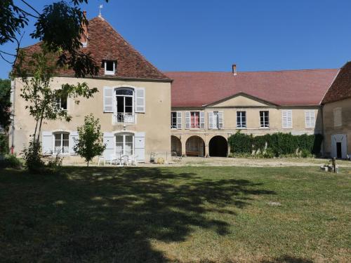 a large white house with a red roof at La demeure d'Aiglepierre in Aiglepierre