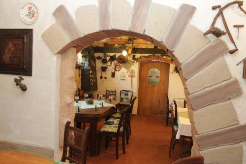 a dining room with a table and chairs at Weinkeller Wölk in Naumburg