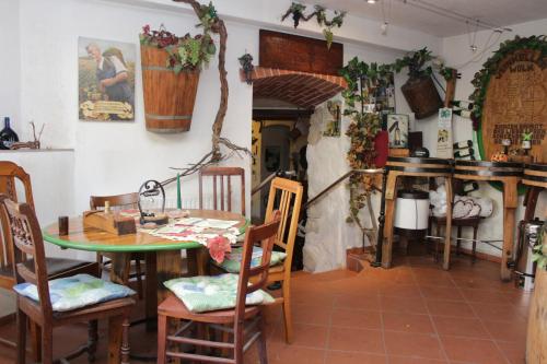 a dining room with a table and chairs at Weinkeller Wölk in Naumburg