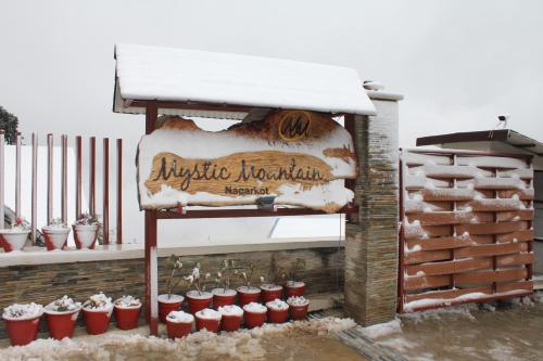 a sign for ayrshire northumberland covered in snow at Hotel Mystic Mountain in Nagarkot
