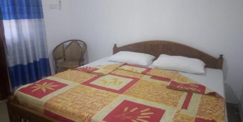 Postel nebo postele na pokoji v ubytování Senuri Homestay