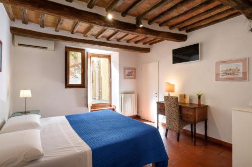 Postel nebo postele na pokoji v ubytování Piazza Paradiso Accommodation