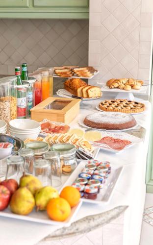 a buffet with many different types of food on a table at B&B Marcantonio - Ischia Ponte in Ischia