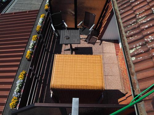 an overhead view of a yellow bench on a balcony at Hotel Meeresruh Garni in Cuxhaven