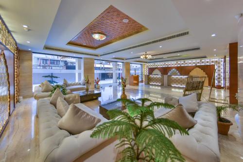 a large living room with a couch and a table at Regenta Central Srinagar, Rajbagh in Srinagar