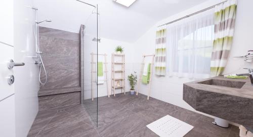 a bathroom with a shower and a sink at Oberschartlhof in Flachau
