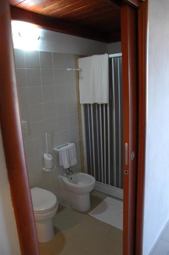 a bathroom with a toilet and a shower at Tenuta Annibale in Leverano