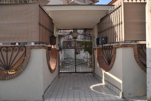 an entrance to a building with a gate at B&b Le Cycas in Castellammare di Stabia