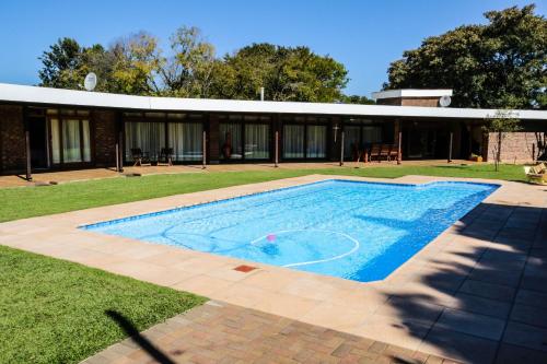 a swimming pool in the yard of a house at Pheasant's Rest in Newcastle