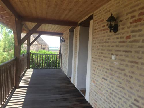 a porch of a house with a wooden walkway at Gite Evidence in Varennes-sur-le-Doubs