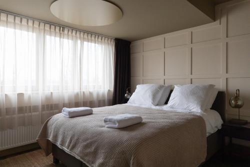 Postel nebo postele na pokoji v ubytování Seabreeze Suites - near Zandvoort aan Zee