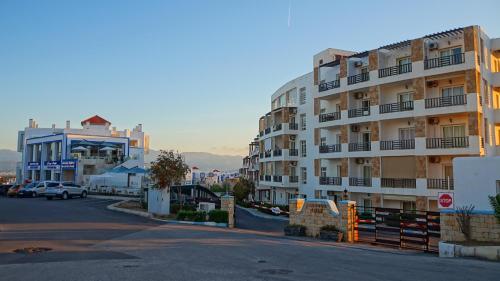 a large apartment building on the side of a street at Mirador Golf Appart-hotel in Cabo Negro
