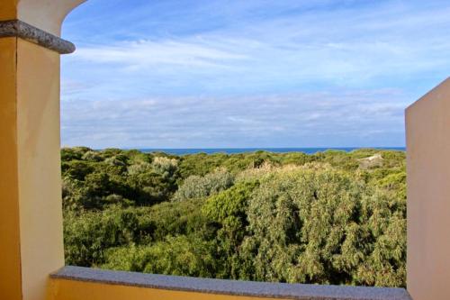 a window view of the ocean from a house at Casa THE NEST - Il Nido sul Mare in Badesi