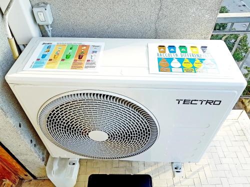 a white washing machine sitting on a floor at Guest House Vecchi in Reggio Emilia