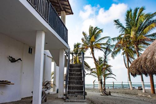 a stairway leading up to a house on the beach at Tadù Playa Hotel in San Bernardo del Viento